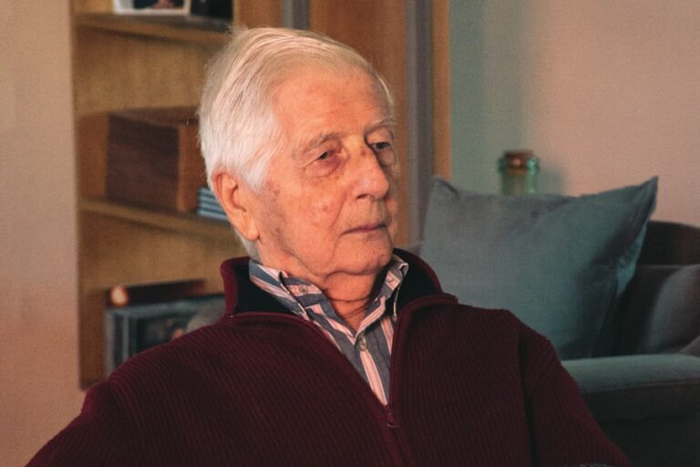 Older man resting and recovering at home after surgery
