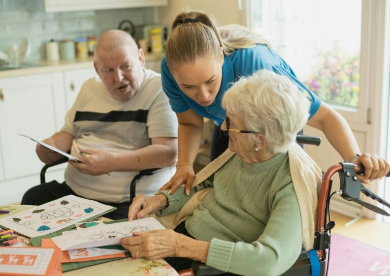 Home health caregiver assisting elderly clients