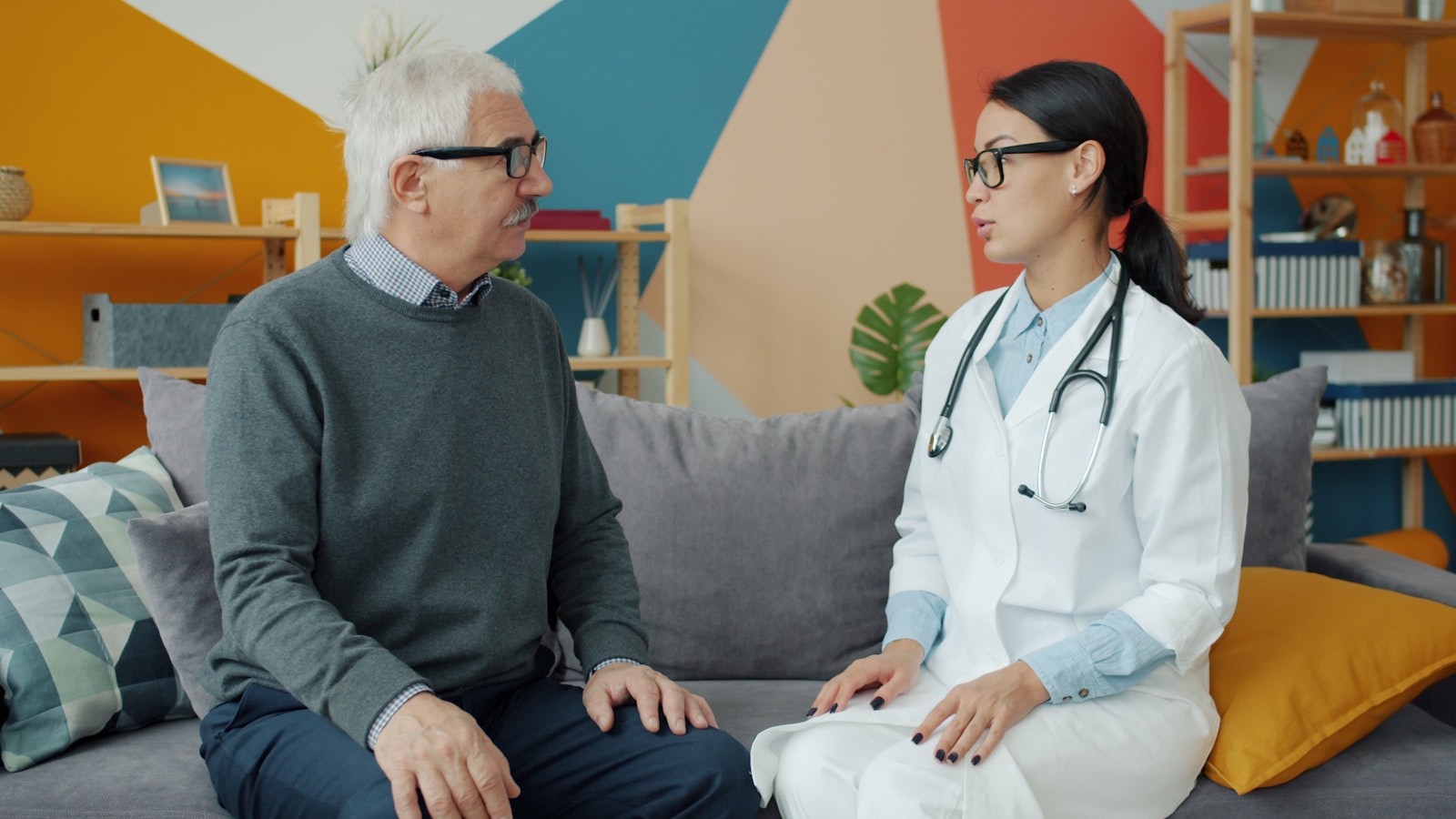 Home health professional consulting with a patient
